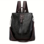 Sac à dos en cuir noir élégant avec fermeture éclair centrale, bretelles ajustables marron, design moderne, idéal pour le travail ou les voyages.